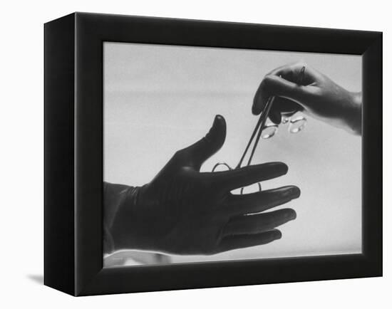 During Training of Surgeon, Often Used Clamp Is Slapped into His Hand-Ed Clark-Framed Premier Image Canvas