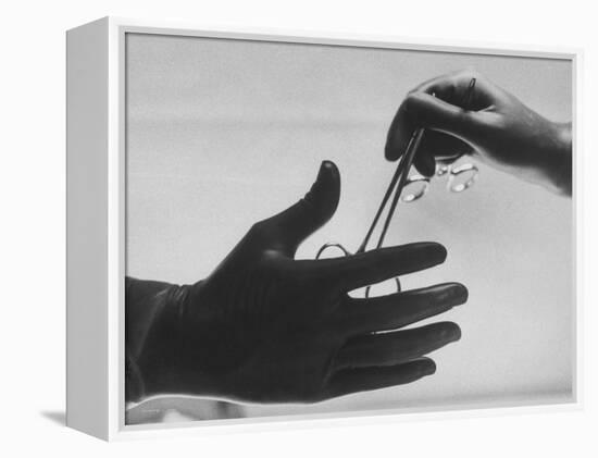 During Training of Surgeon, Often Used Clamp Is Slapped into His Hand-Ed Clark-Framed Premier Image Canvas