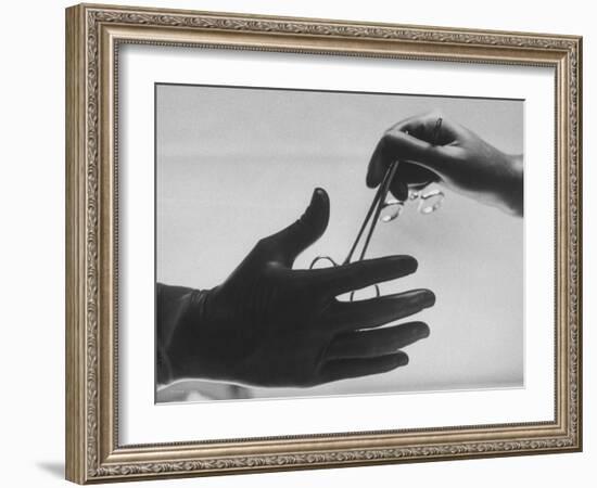 During Training of Surgeon, Often Used Clamp Is Slapped into His Hand-Ed Clark-Framed Photographic Print