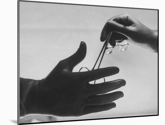 During Training of Surgeon, Often Used Clamp Is Slapped into His Hand-Ed Clark-Mounted Photographic Print