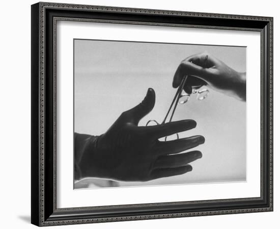 During Training of Surgeon, Often Used Clamp Is Slapped into His Hand-Ed Clark-Framed Photographic Print