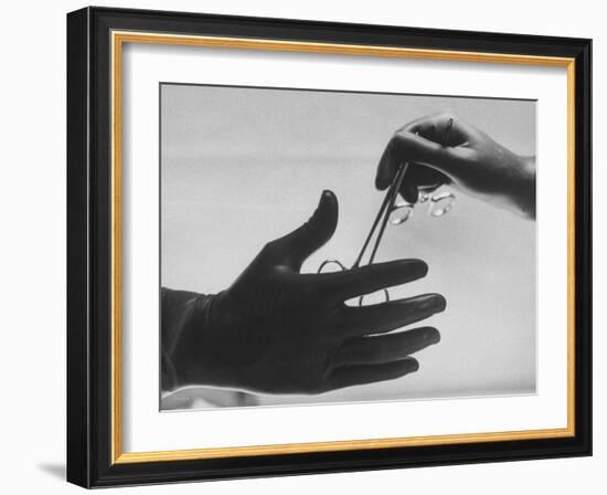 During Training of Surgeon, Often Used Clamp Is Slapped into His Hand-Ed Clark-Framed Photographic Print