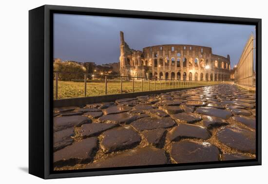 Dusk lights on the Colosseum, the old Flavian Amphitheatre, and symbol of the city, UNESCO World He-Roberto Moiola-Framed Premier Image Canvas