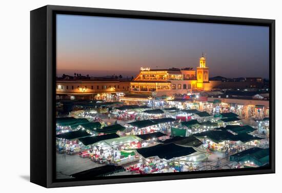 Dusk lights over the iconic markets in Jemaa el Fna square, Marrakech, Morocco, North Africa-Roberto Moiola-Framed Premier Image Canvas