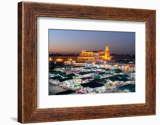 Dusk lights over the iconic markets in Jemaa el Fna square, Marrakech, Morocco, North Africa-Roberto Moiola-Framed Photographic Print