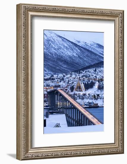 Dusk over the illuminated Bruvegen Bridge and Arctic Cathedral in winter, Tromso-Roberto Moiola-Framed Photographic Print