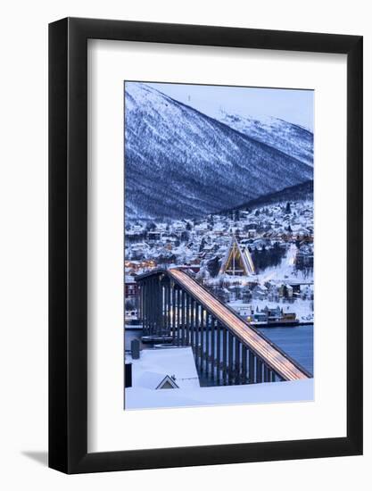 Dusk over the illuminated Bruvegen Bridge and Arctic Cathedral in winter, Tromso-Roberto Moiola-Framed Photographic Print