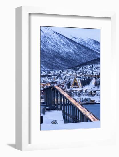 Dusk over the illuminated Bruvegen Bridge and Arctic Cathedral in winter, Tromso-Roberto Moiola-Framed Photographic Print