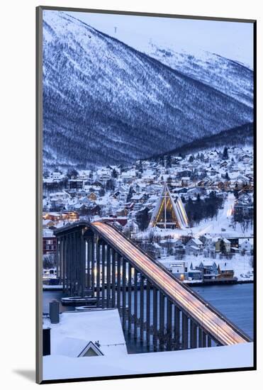 Dusk over the illuminated Bruvegen Bridge and Arctic Cathedral in winter, Tromso-Roberto Moiola-Mounted Photographic Print