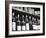 Dust-Covered Wine and Brandy Bottles Standing on Racks in a Wine Cellar-null-Framed Photographic Print