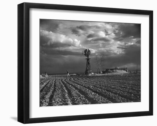 Dust Storm Rising over Farmer Walking Across His Plowed Field-Margaret Bourke-White-Framed Photographic Print