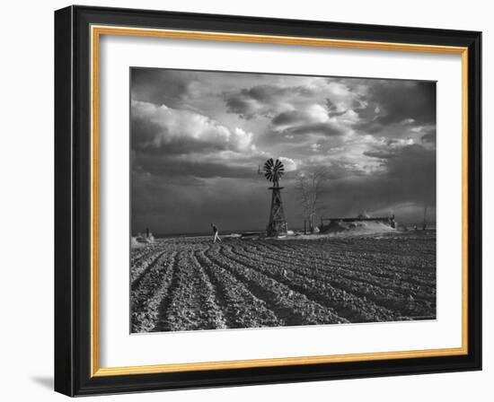 Dust Storm Rising over Farmer Walking Across His Plowed Field-Margaret Bourke-White-Framed Photographic Print