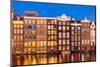 Dutch gables on row of typical Amsterdam houses at night with reflections in the Damrak canal-Neale Clark-Mounted Photographic Print