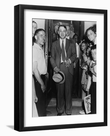 Dutch Schultz, Emerging from Doorway of Malone County Jail, in an Upstate New York Town, 1936-null-Framed Photo