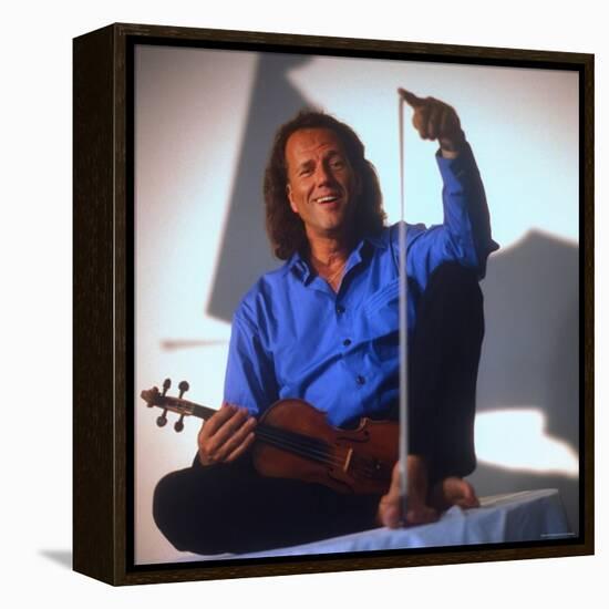 Dutch Violinist Andre Rieu Relaxing, Taking Practice Break with Violin-Ted Thai-Framed Premier Image Canvas