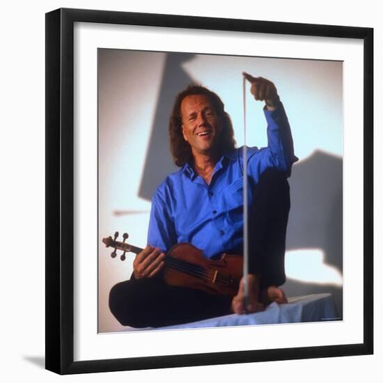 Dutch Violinist Andre Rieu Relaxing, Taking Practice Break with Violin-Ted Thai-Framed Premium Photographic Print