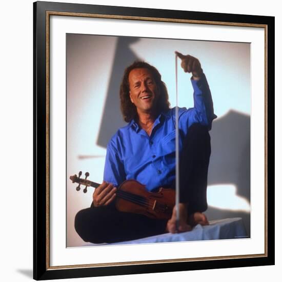 Dutch Violinist Andre Rieu Relaxing, Taking Practice Break with Violin-Ted Thai-Framed Premium Photographic Print