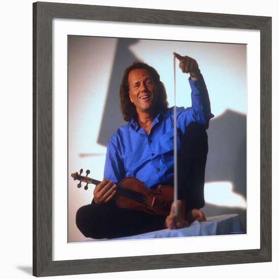 Dutch Violinist Andre Rieu Relaxing, Taking Practice Break with Violin-Ted Thai-Framed Premium Photographic Print