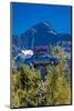Eads Auto, Seward Alaska - a car in the trees under a large mountain-null-Mounted Photographic Print