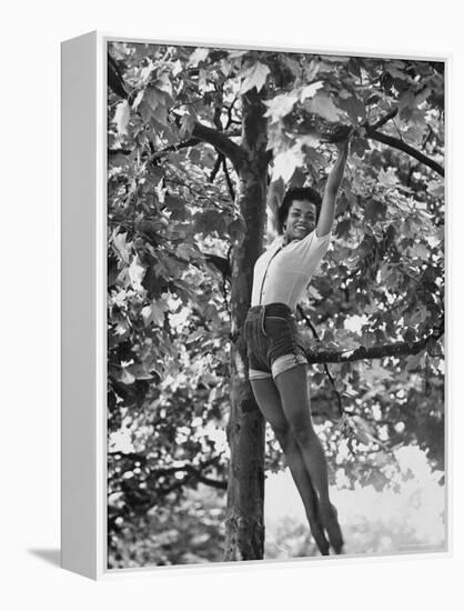 Eartha Kitt Playing in the Tree-Gordon Parks-Framed Premier Image Canvas