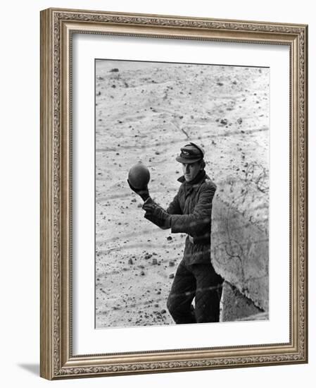 East German Border Guard Tossing Ball over Berlin Wall after German boy accidently threw it over-Paul Schutzer-Framed Photographic Print