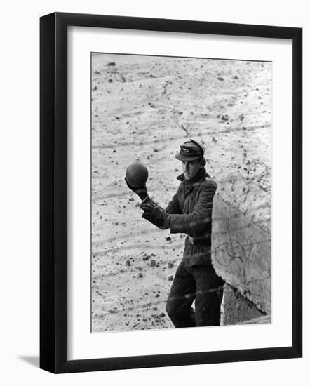 East German Border Guard Tossing Ball over Berlin Wall after German boy accidently threw it over-Paul Schutzer-Framed Photographic Print