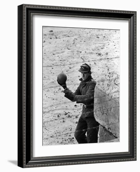 East German Border Guard Tossing Ball over Berlin Wall after German boy accidently threw it over-Paul Schutzer-Framed Photographic Print