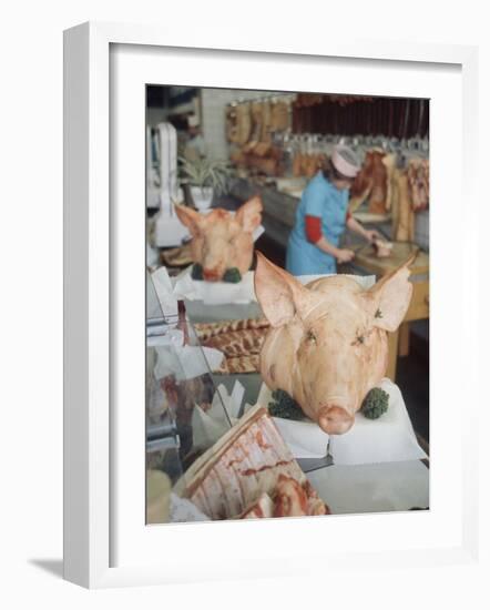 East German Butcher Shop, Displaying Whole Pigs Heads-Ralph Crane-Framed Photographic Print