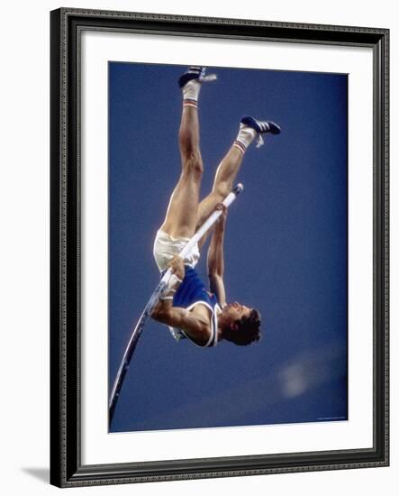 East Germany's Wolfgang Nordwig in Action During Pole Vaulting Event at the Summer Olympics-John Dominis-Framed Premium Photographic Print