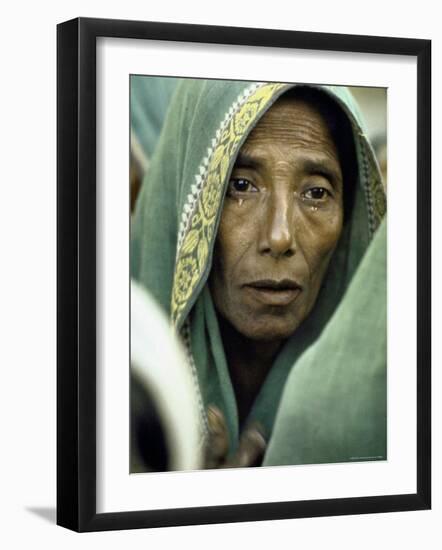 East Pakistani Looking Forlorn While Waiting For Rations from British Troops After Cyclone Disaster-Larry Burrows-Framed Photographic Print