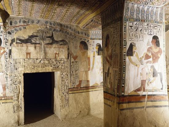 east wall of burial chamber with entrance decorated with figures of
