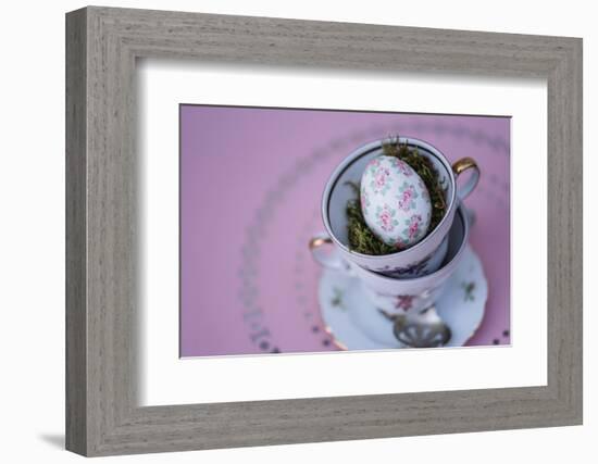 Easter decoration, coffee cups, stacked, Easter egg, bird's-eye view-mauritius images-Framed Photographic Print