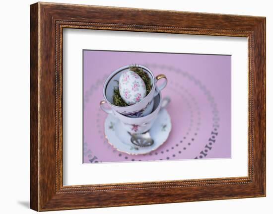 Easter decoration, coffee cups, stacked, Easter egg, bird's-eye view-mauritius images-Framed Photographic Print