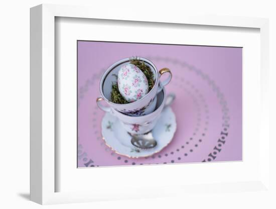 Easter decoration, coffee cups, stacked, Easter egg, bird's-eye view-mauritius images-Framed Photographic Print