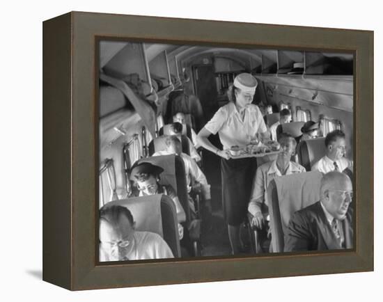 Eastern Airline Travelers Receiving a Mid-Flight Meal from a Female Steward-null-Framed Premier Image Canvas