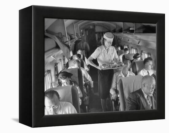 Eastern Airline Travelers Receiving a Mid-Flight Meal from a Female Steward-null-Framed Premier Image Canvas