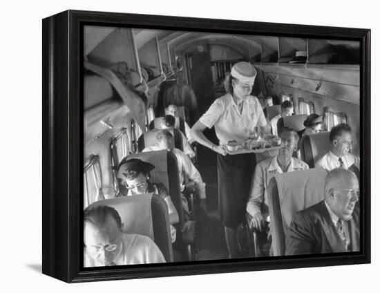 Eastern Airline Travelers Receiving a Mid-Flight Meal from a Female Steward-null-Framed Premier Image Canvas