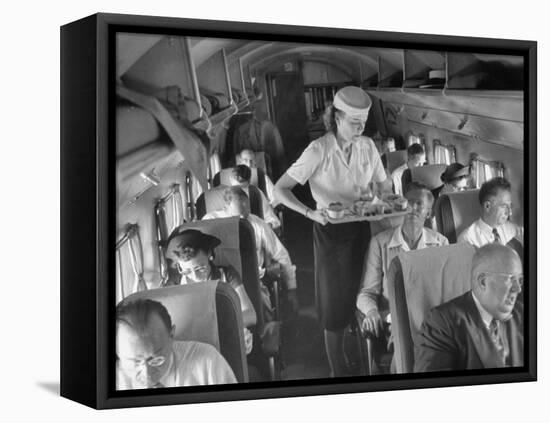 Eastern Airline Travelers Receiving a Mid-Flight Meal from a Female Steward-null-Framed Premier Image Canvas