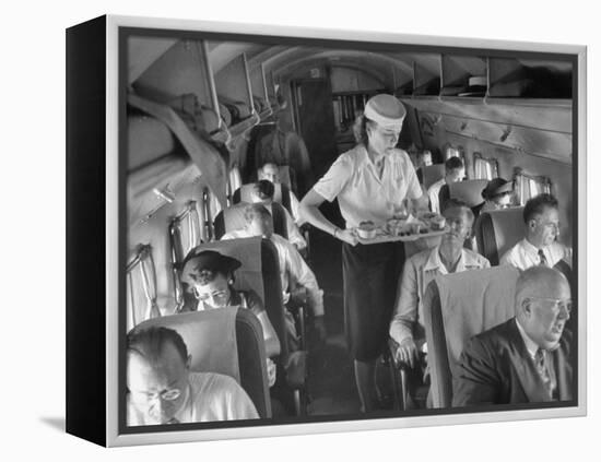 Eastern Airline Travelers Receiving a Mid-Flight Meal from a Female Steward-null-Framed Premier Image Canvas