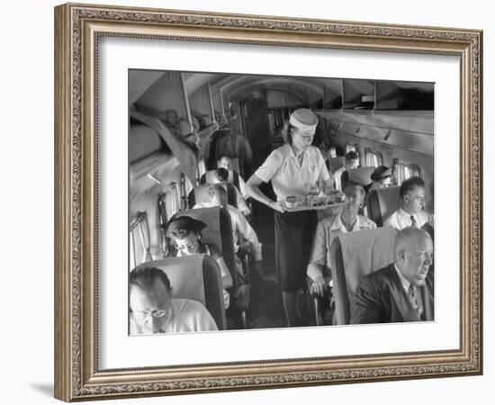 Eastern Airline Travelers Receiving a Mid-Flight Meal from a Female Steward-null-Framed Photographic Print