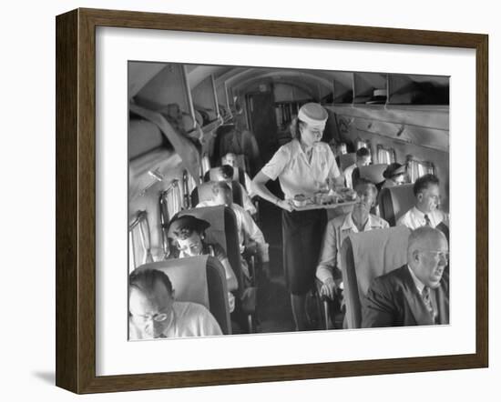 Eastern Airline Travelers Receiving a Mid-Flight Meal from a Female Steward-null-Framed Photographic Print