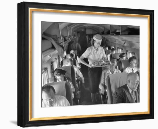 Eastern Airline Travelers Receiving a Mid-Flight Meal from a Female Steward-null-Framed Photographic Print