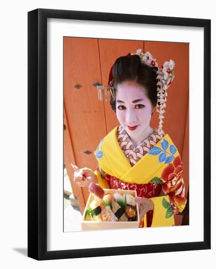 Eating Sushi, Apprentice Geisha (Maiko) Dressed in Kimono, Kyoto, Honshu, Japan-null-Framed Photographic Print