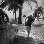 The Cadillac That Has Everything, Jackie Smithwick Taking a Warm Shower Next to the Front Fender-Ed Clark-Photographic Print