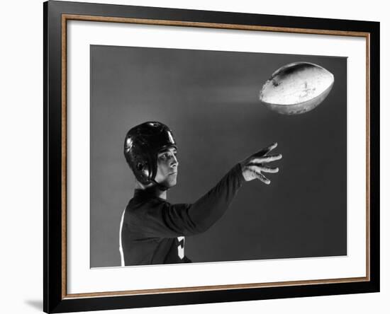 Eddie Miller of NY Giants Demonstrates Spiral Pass by Gripping Ball Along Lacing Close to the Ear-Gjon Mili-Framed Premium Photographic Print