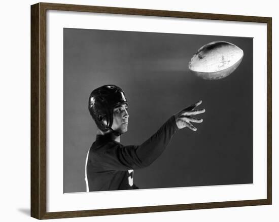 Eddie Miller of NY Giants Demonstrates Spiral Pass by Gripping Ball Along Lacing Close to the Ear-Gjon Mili-Framed Premium Photographic Print