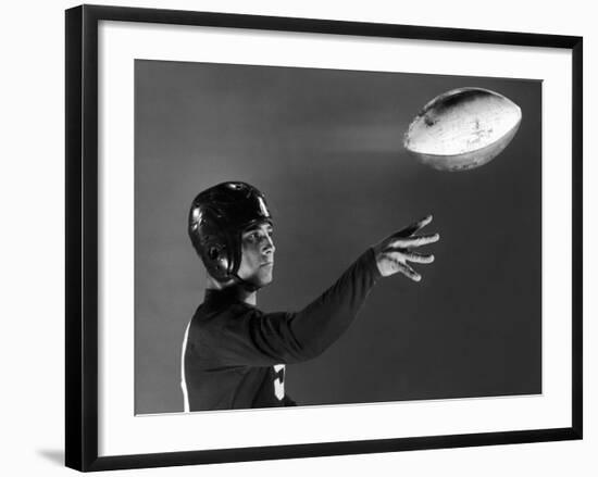 Eddie Miller of NY Giants Demonstrates Spiral Pass by Gripping Ball Along Lacing Close to the Ear-Gjon Mili-Framed Premium Photographic Print