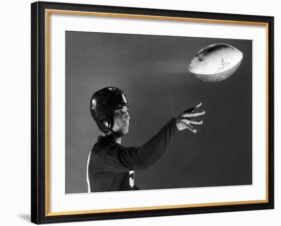 Eddie Miller of NY Giants Demonstrates Spiral Pass by Gripping Ball Along Lacing Close to the Ear-Gjon Mili-Framed Premium Photographic Print