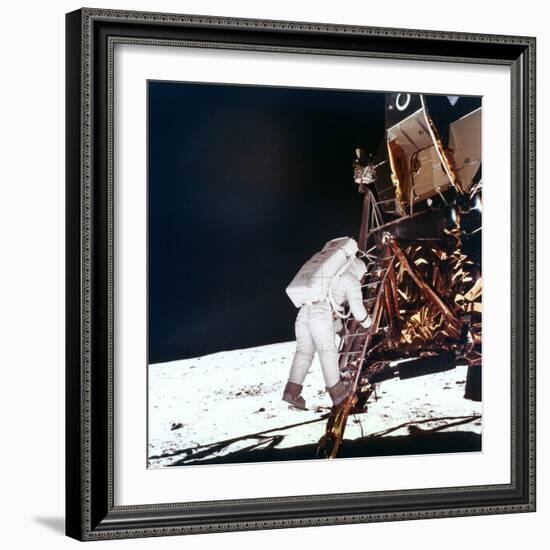 Edwin Buzz Aldrin Descends the Steps of the Lunar Module Ladder to Walk on the Moon, 1969-null-Framed Photographic Print