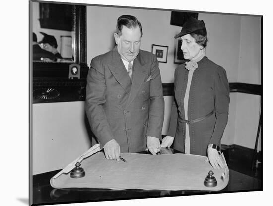 Edwin H. Dressel and Nellie Tayloe Ross discuss the United States gold reserve, 1937-Harris & Ewing-Mounted Photographic Print